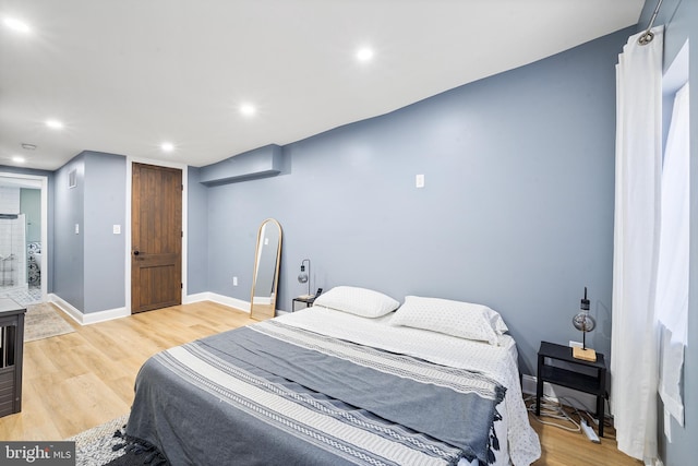 bedroom featuring light wood-type flooring