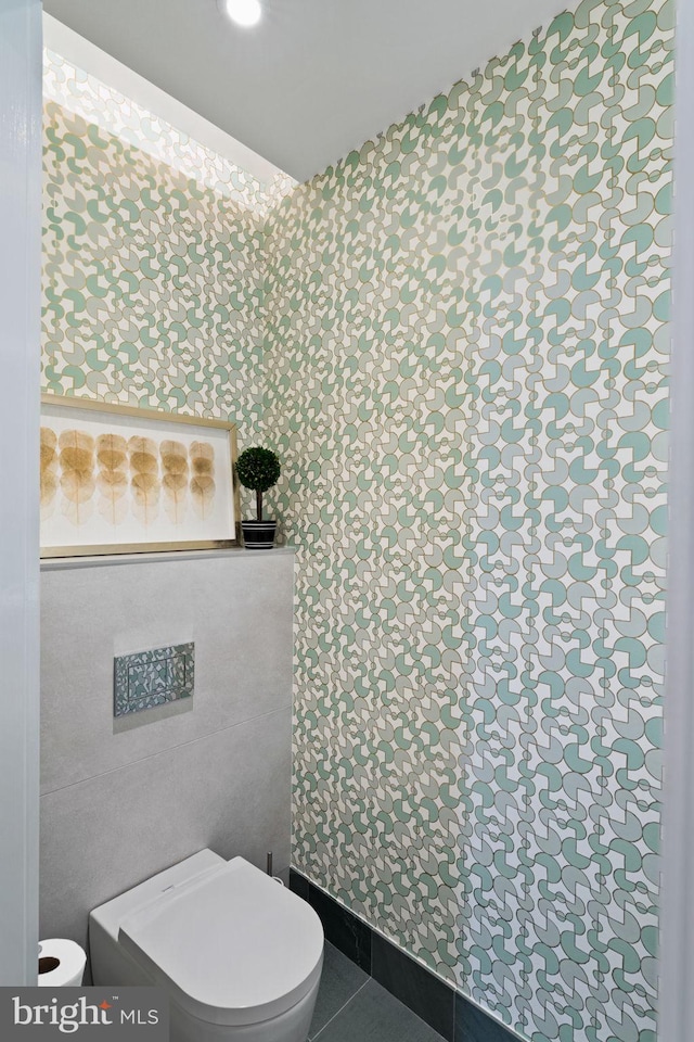 bathroom with tile patterned flooring and toilet