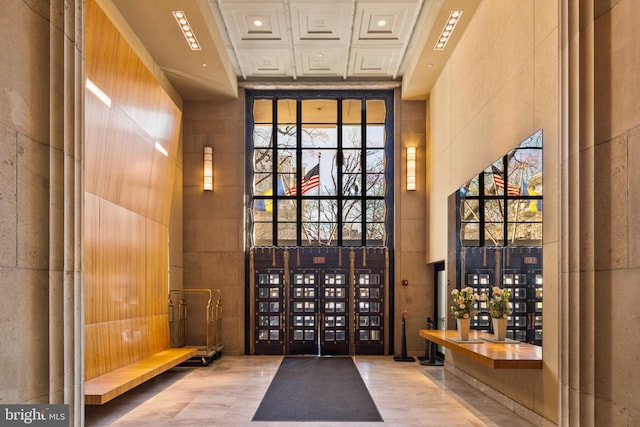 interior space with expansive windows and a towering ceiling