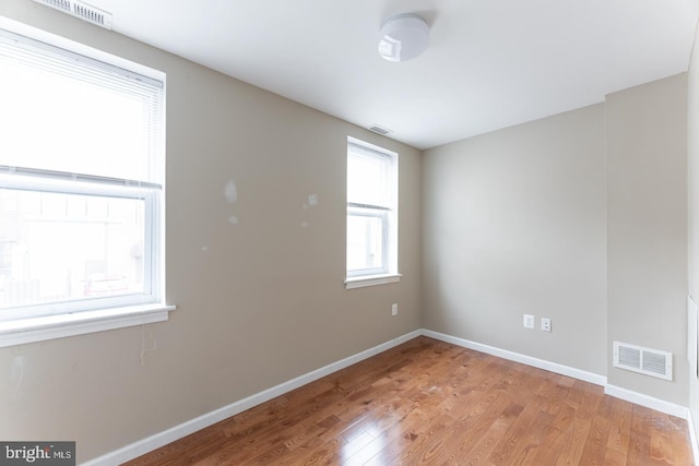 spare room featuring light hardwood / wood-style flooring