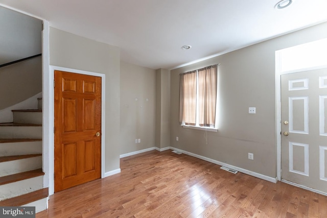 foyer entrance with light hardwood / wood-style floors