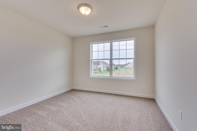 spare room featuring carpet