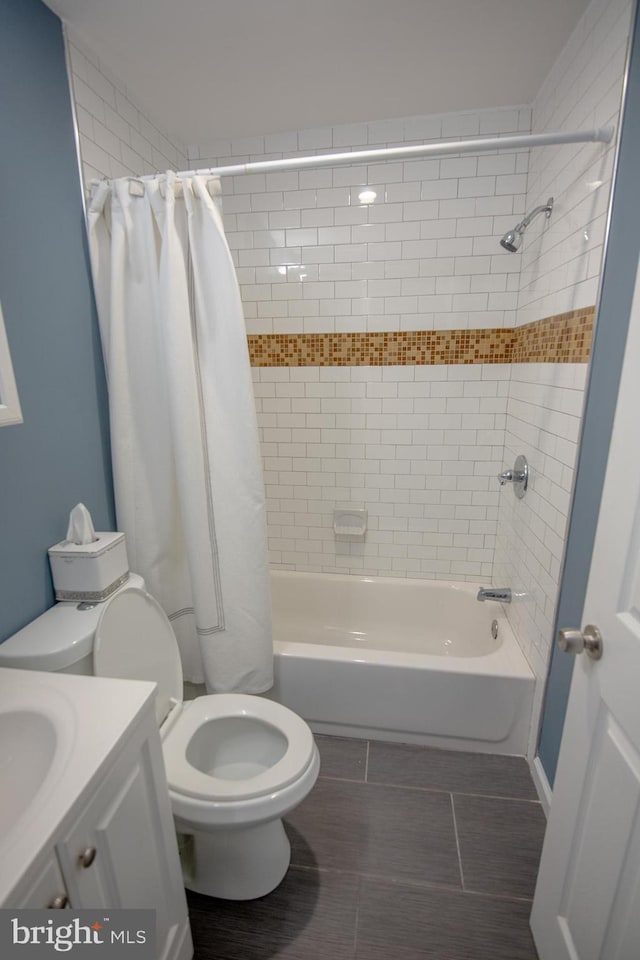 full bathroom with vanity, toilet, and shower / bath combo with shower curtain