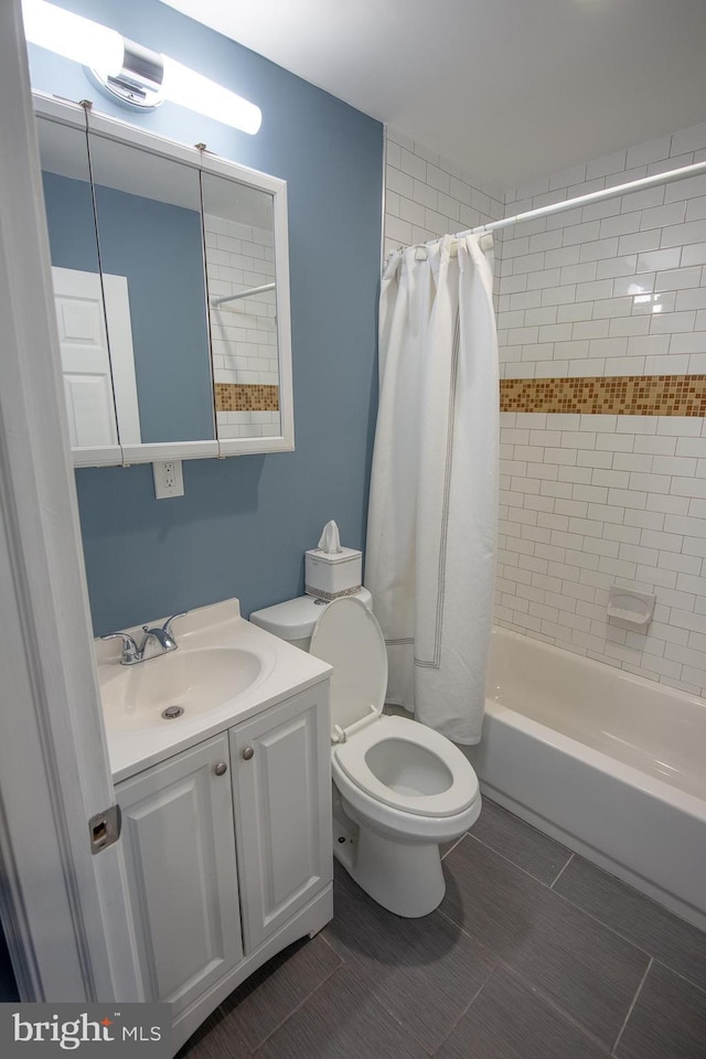 full bathroom featuring vanity, shower / bathtub combination with curtain, and toilet