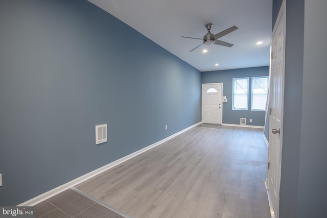 interior space featuring light hardwood / wood-style floors and ceiling fan