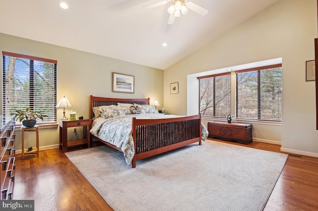 bedroom featuring lofted ceiling, recessed lighting, a ceiling fan, wood finished floors, and baseboards