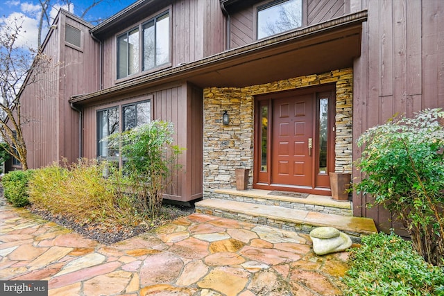 view of exterior entry with stone siding