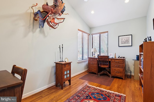 home office featuring recessed lighting, vaulted ceiling, baseboards, and wood finished floors