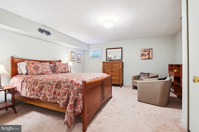 bedroom featuring light carpet