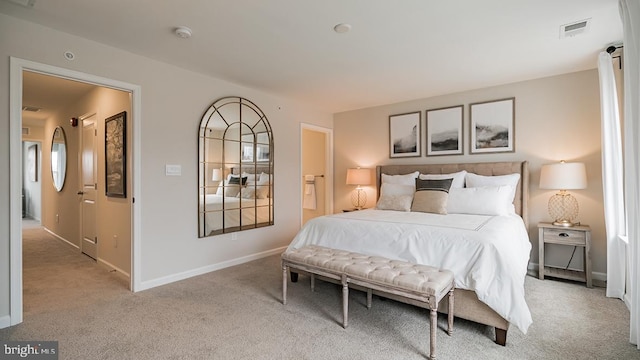 bedroom with light colored carpet