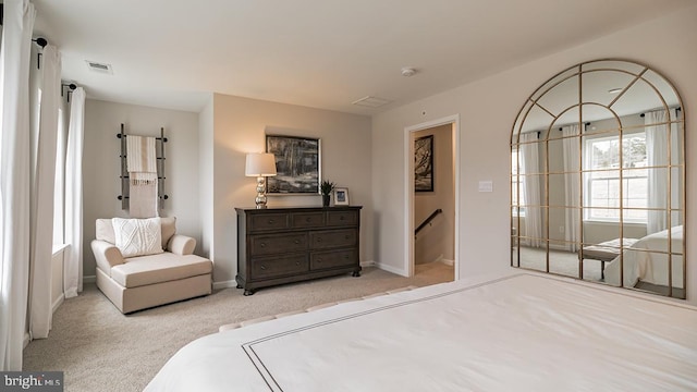 bedroom featuring light carpet