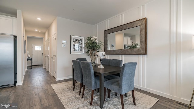 dining room featuring dark hardwood / wood-style flooring