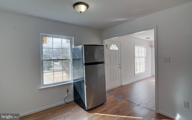 entrance foyer with a wealth of natural light and light hardwood / wood-style floors