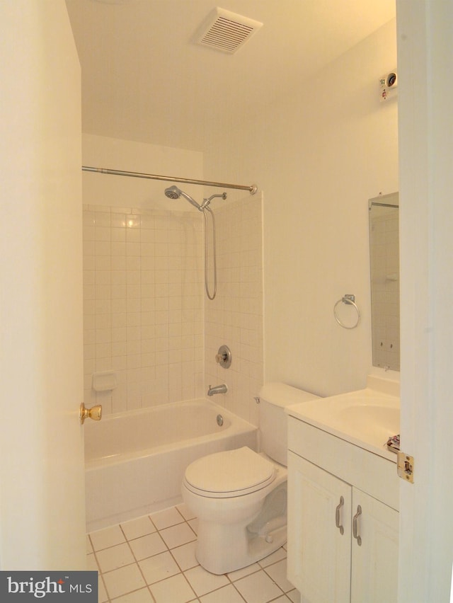 full bathroom with tile patterned flooring, vanity, toilet, and tiled shower / bath