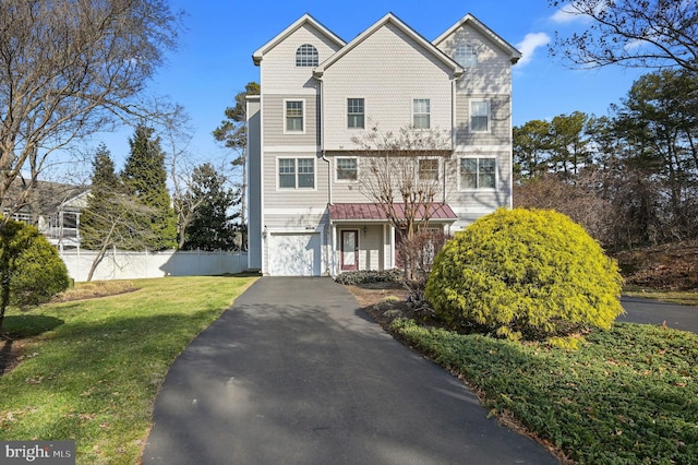 front of property featuring a garage and a front yard