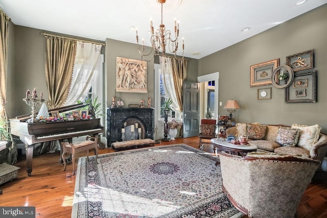 living room with wood-type flooring and a notable chandelier