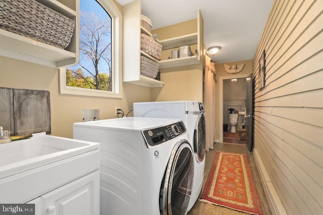 laundry room featuring washing machine and clothes dryer