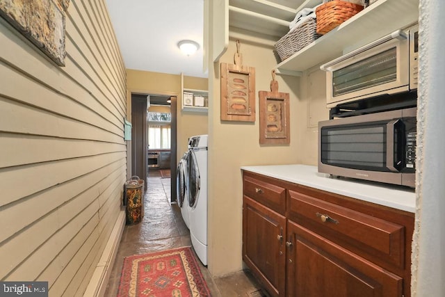 clothes washing area with independent washer and dryer