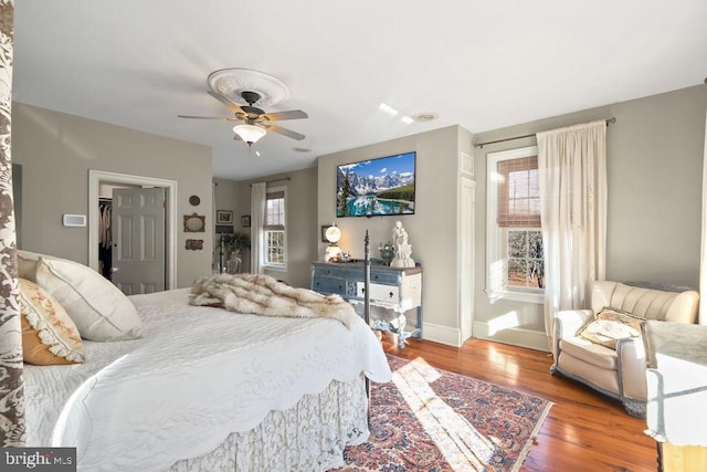 bedroom featuring ceiling fan and wood-type flooring