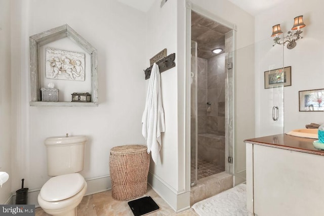 bathroom with toilet and a shower with shower door