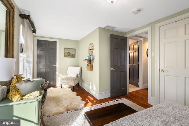 bedroom with hardwood / wood-style floors