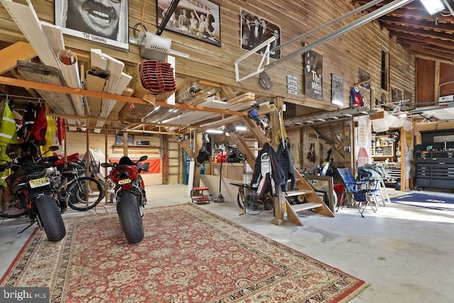 garage featuring wooden walls