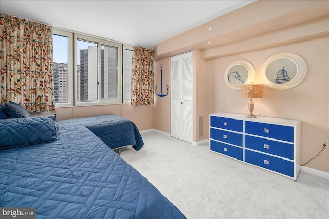 carpeted bedroom with a closet