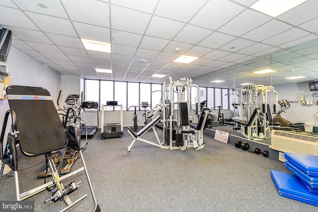 exercise room featuring a paneled ceiling