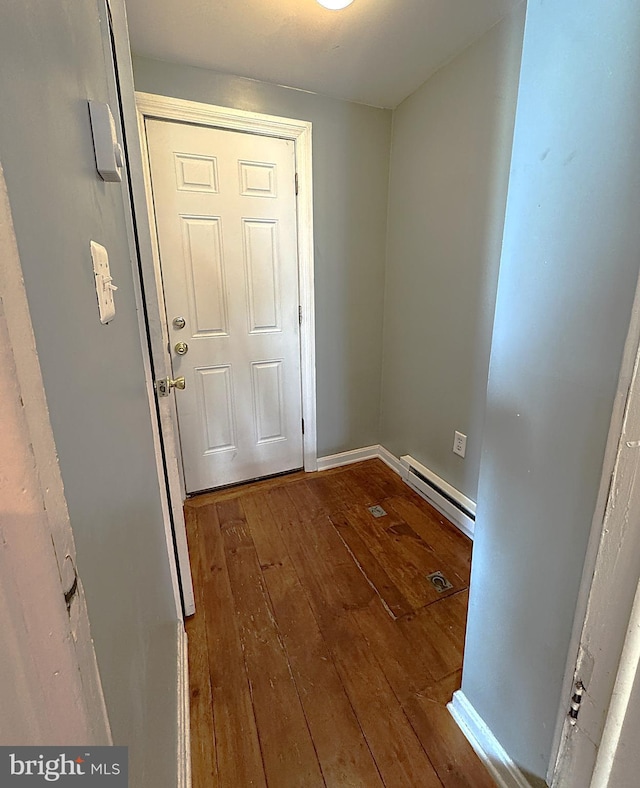 entryway with a baseboard heating unit and hardwood / wood-style floors