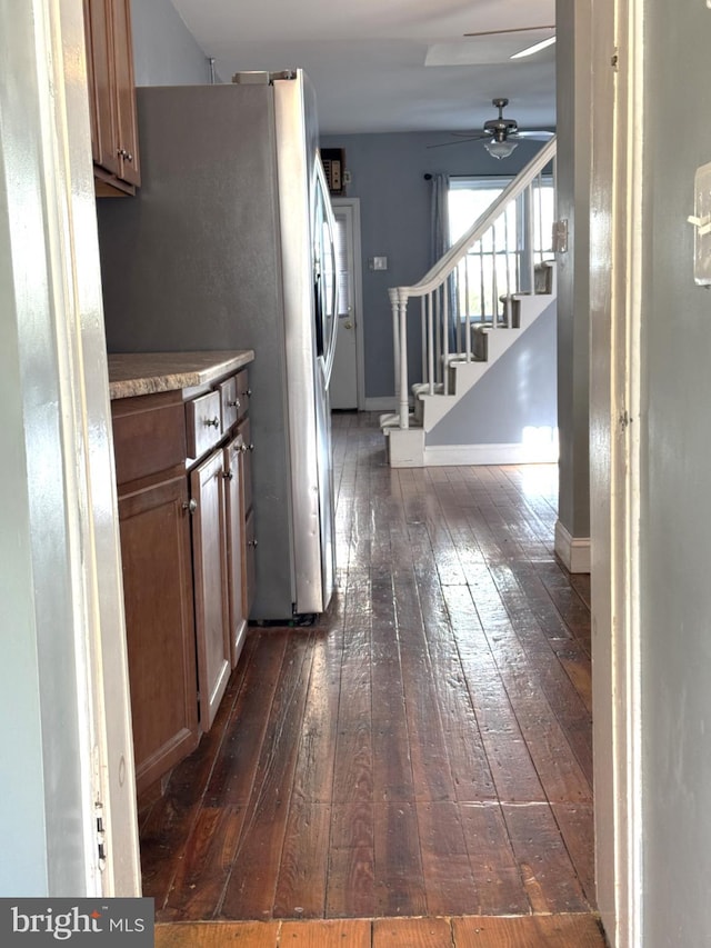 kitchen featuring ceiling fan and dark hardwood / wood-style floors