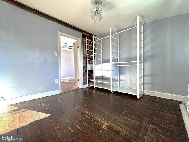 unfurnished bedroom with dark hardwood / wood-style floors