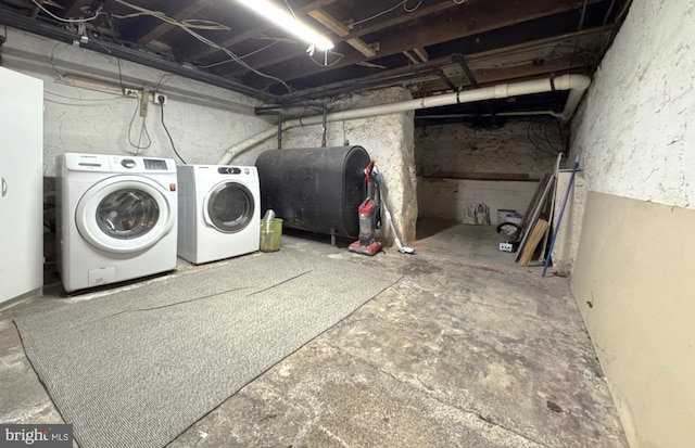 clothes washing area featuring washer and dryer