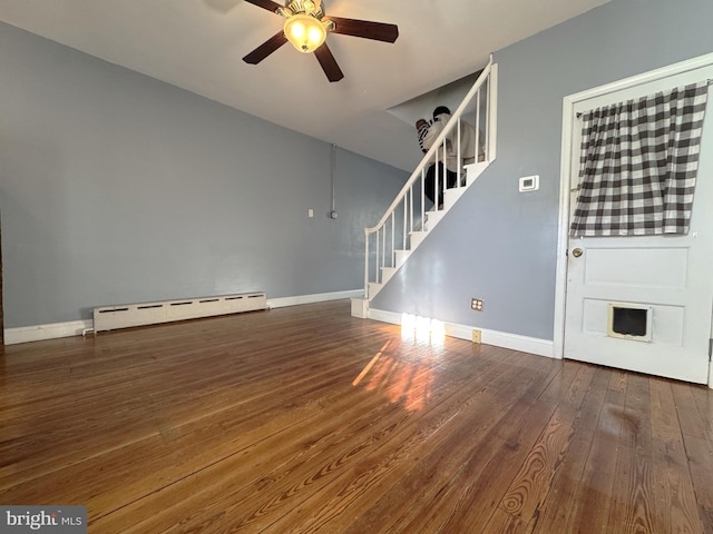 unfurnished room with ceiling fan, a baseboard radiator, dark hardwood / wood-style floors, and vaulted ceiling