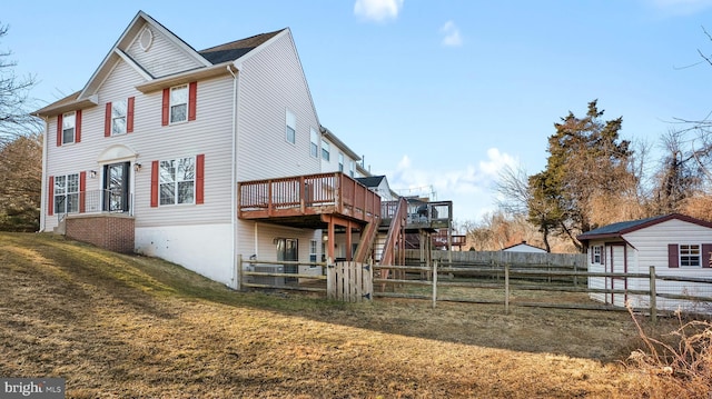 view of home's exterior featuring a yard and a wooden deck