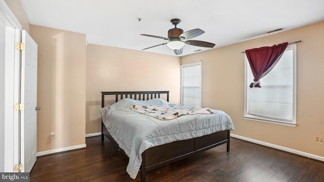 bedroom featuring dark hardwood / wood-style flooring and ceiling fan