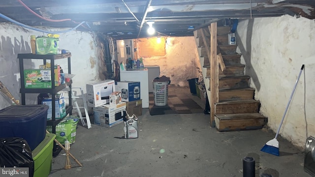 basement featuring washer / dryer and electric panel