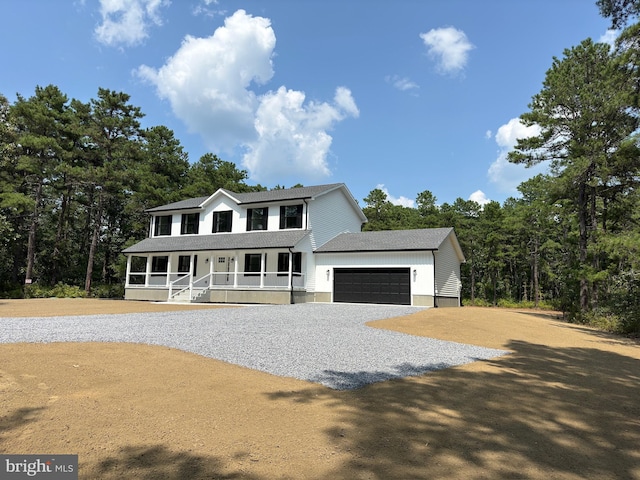 view of front of home featuring a garage and covered porch