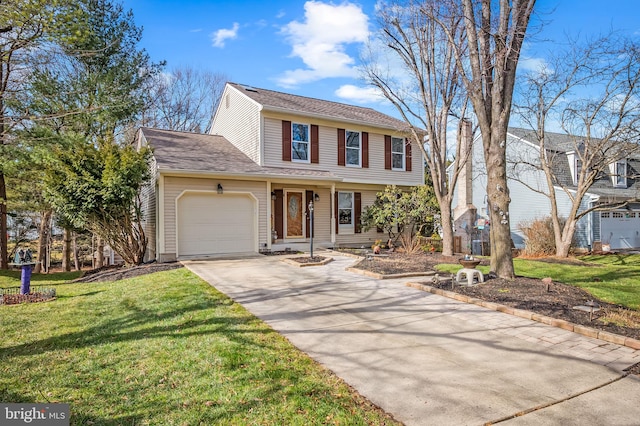 view of front of property featuring a garage and a front yard