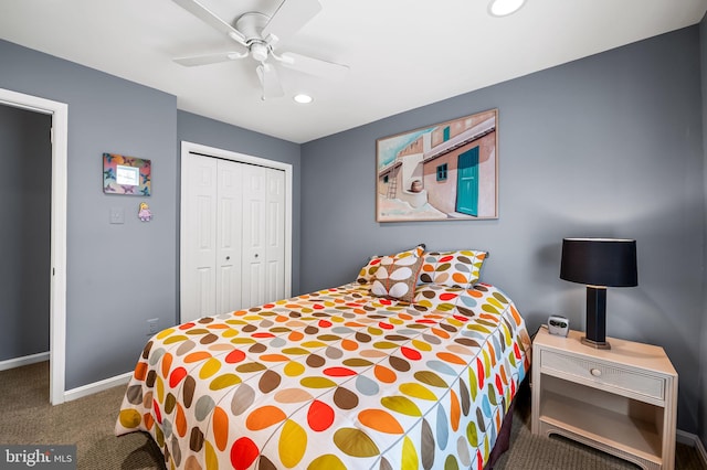 carpeted bedroom with ceiling fan and a closet