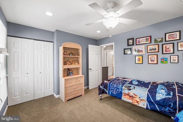 bedroom with carpet, ceiling fan, and a closet