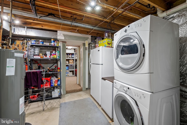 laundry room featuring stacked washer and dryer and electric water heater