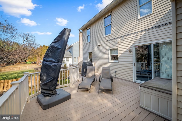 wooden terrace featuring area for grilling