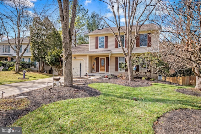 view of front of home featuring a garage and a front yard