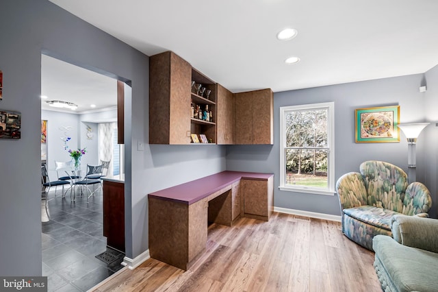 home office with hardwood / wood-style floors