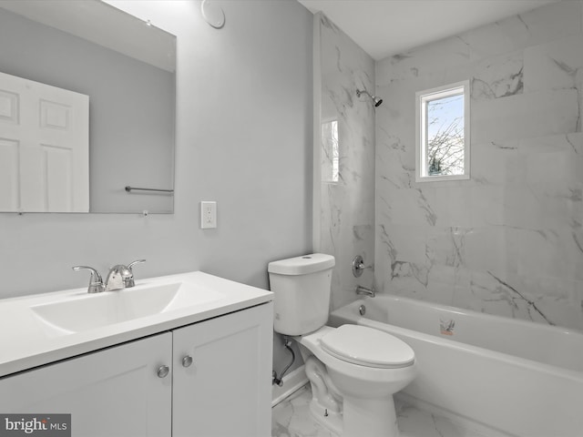 bathroom with toilet, marble finish floor, tub / shower combination, and vanity