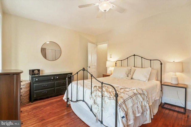 bedroom featuring ceiling fan and dark hardwood / wood-style floors