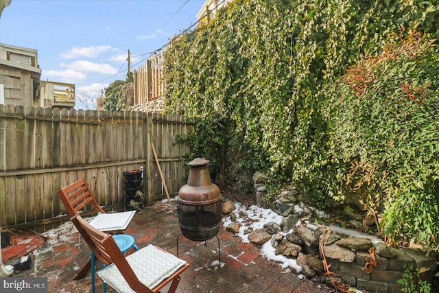 view of patio with a fire pit