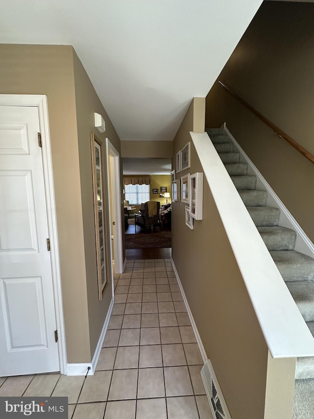 interior space featuring light tile patterned floors