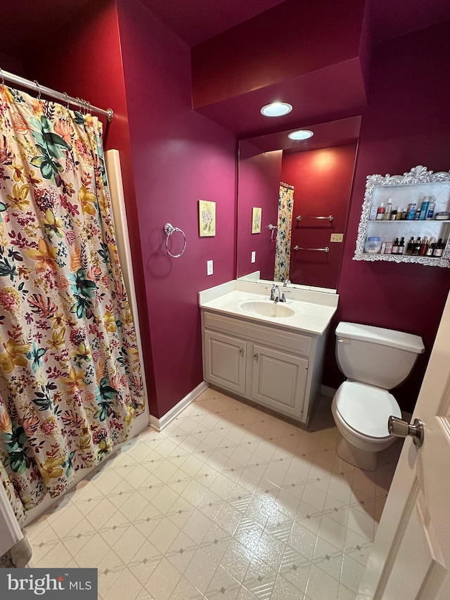 bathroom with vanity and toilet