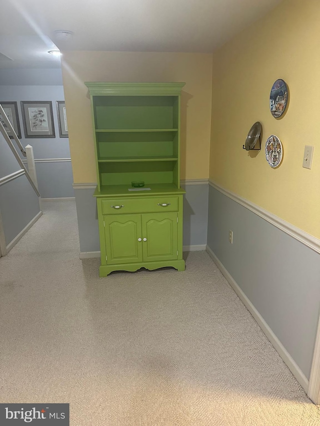 interior space featuring light colored carpet